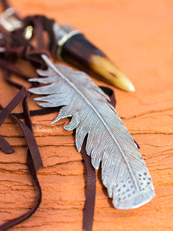 Horn, Horse, feather or cross
